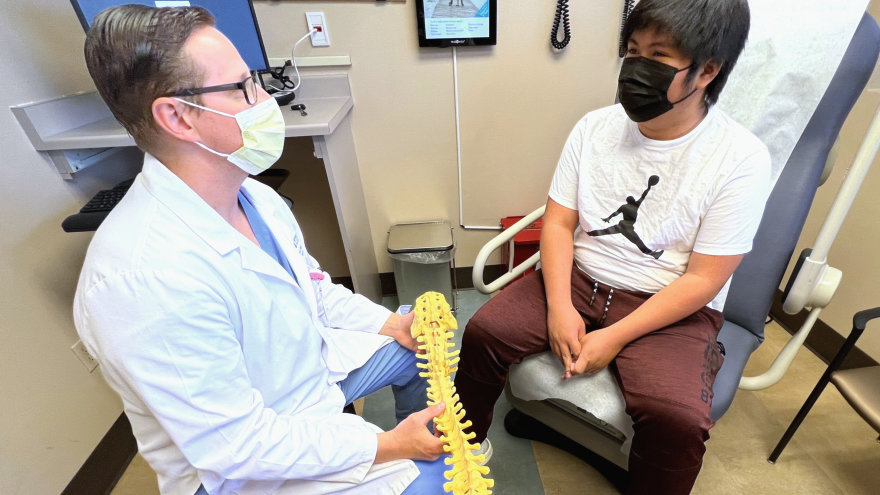 Patient Paul Palma (right) and Dr. Maloney (left) reconnecting after his spine surgery.