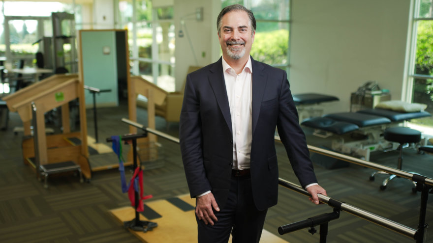 Dr. Caravelli, Orthopedic Surgeon, standing in NorthBay's physical rehabilitation room in Vacaville.